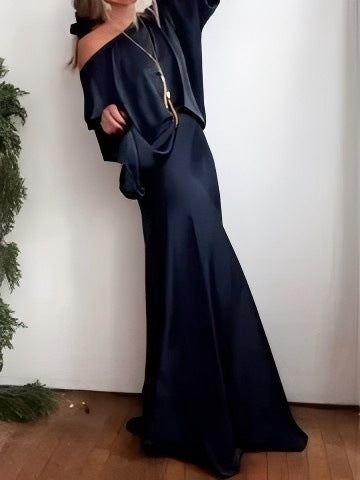 A Sleek Solid-color Satin Dress With Smooth Lines